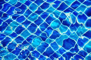 Beautiful custom glass tile with water reflecting over it.