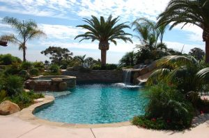 A freeform pool that looks like a dessert oasis.